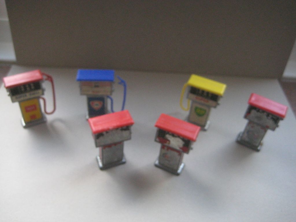 A Group of Six Vintage Metal Miniature Petrol Pumps