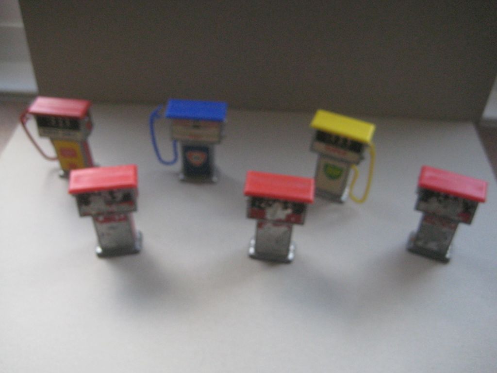 A Group of Six Vintage Metal Miniature Petrol Pumps