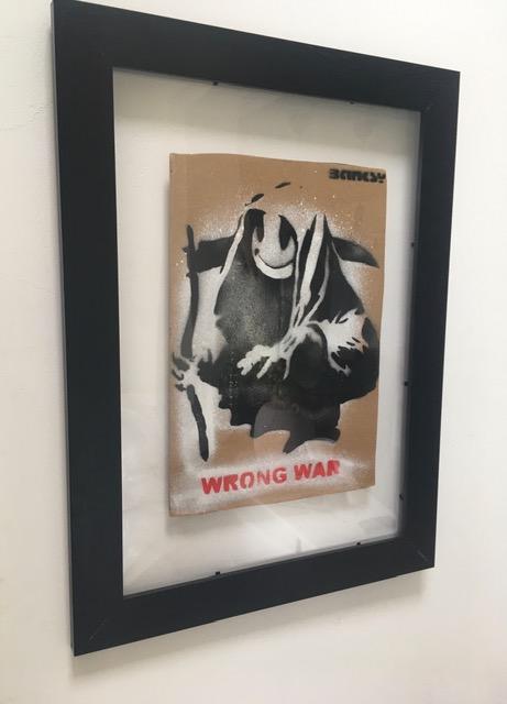 Banksy (b1974) ‘Wrong War’ & 6 Dismaland Bemusement Park Souvenirs Inc Framed Banksy Free Art, 2015