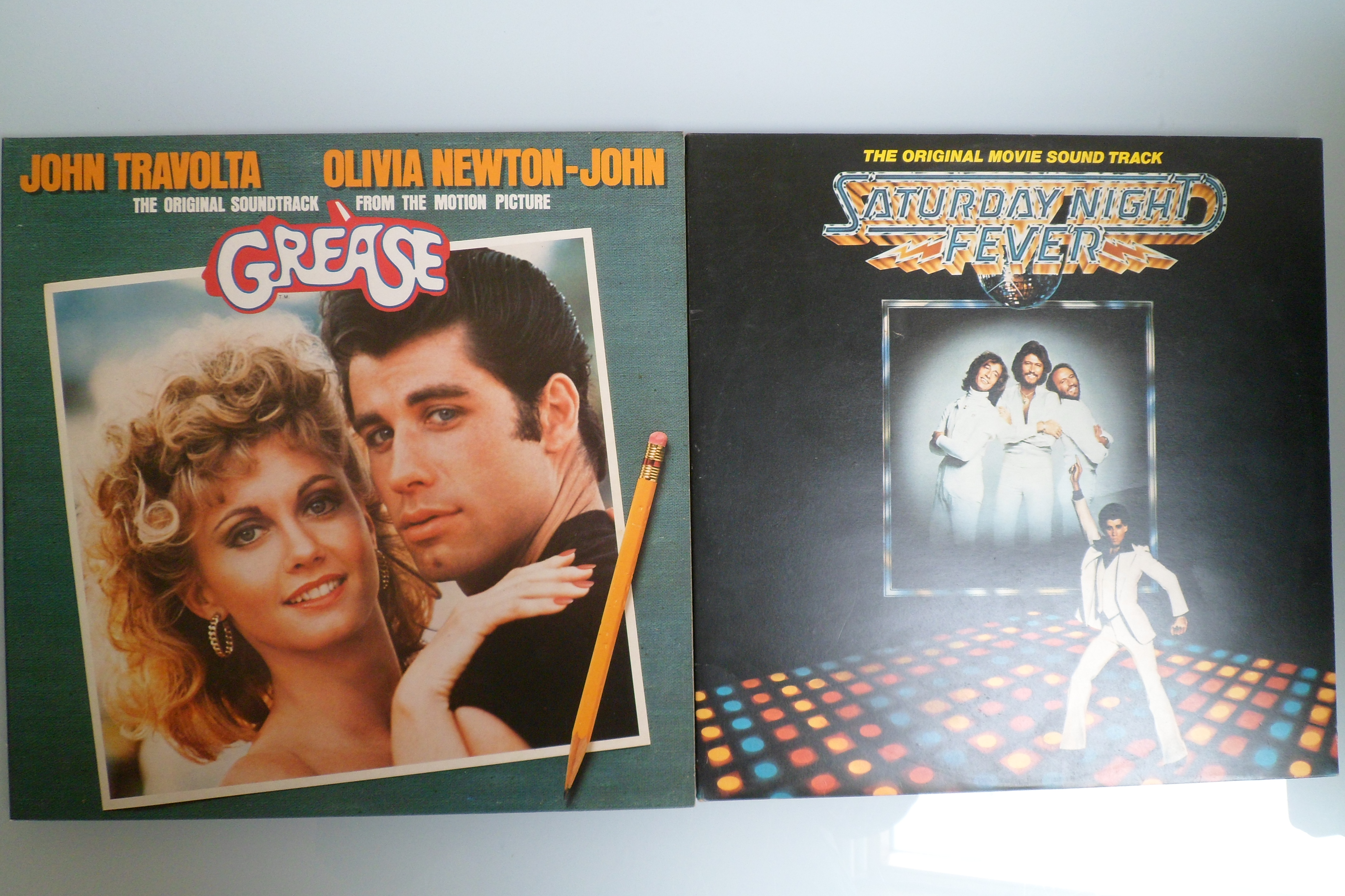 2 x Grease & Saturday night fever vinyl records.