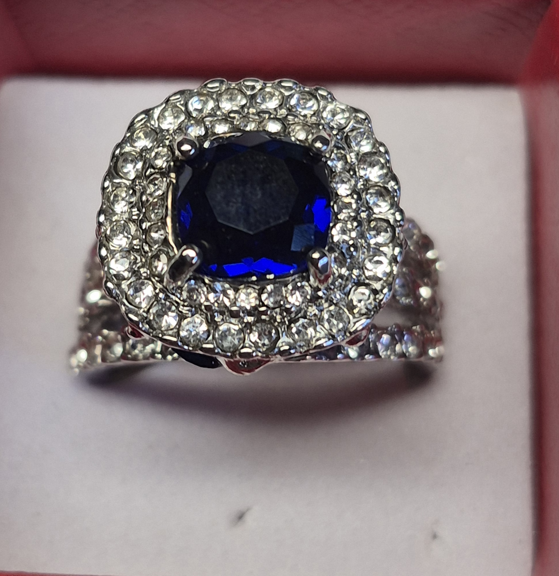 Silver-Plated Ring With Deep Blue Cushion-Cut Stone & Halo Accent Design