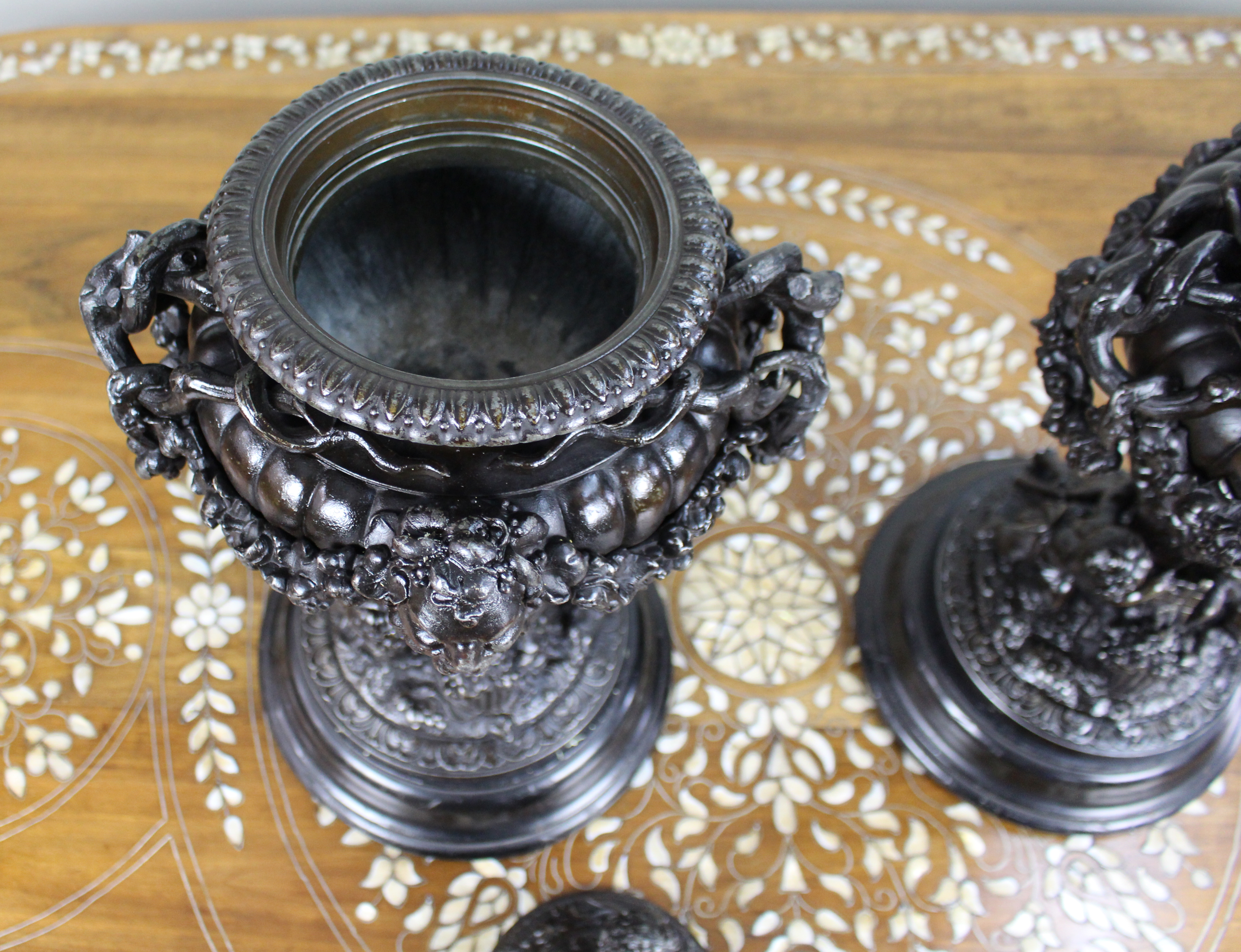 Pair of French Bronzed Spelter Urns with Bacchic Masks and Putti, Circa 1880