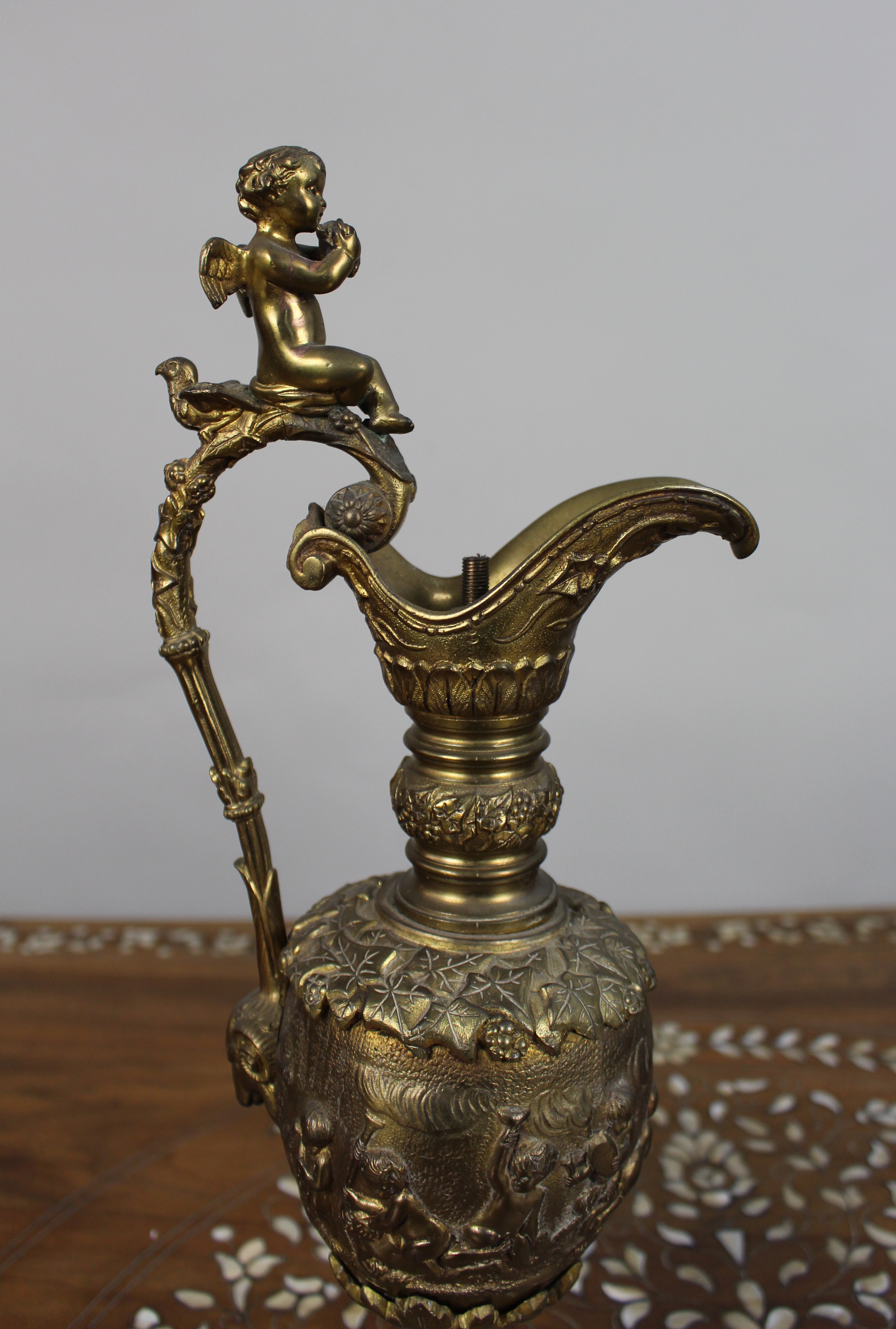 Pair of 19th Century French Gilt Bronze Bacchanalian Ewers with Cherubs