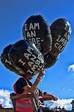 David Shrigley OBE (b 1968) ‘I Am An Imbecile’ Balloon, & Official Banksy Dismaland Programme, 2015
