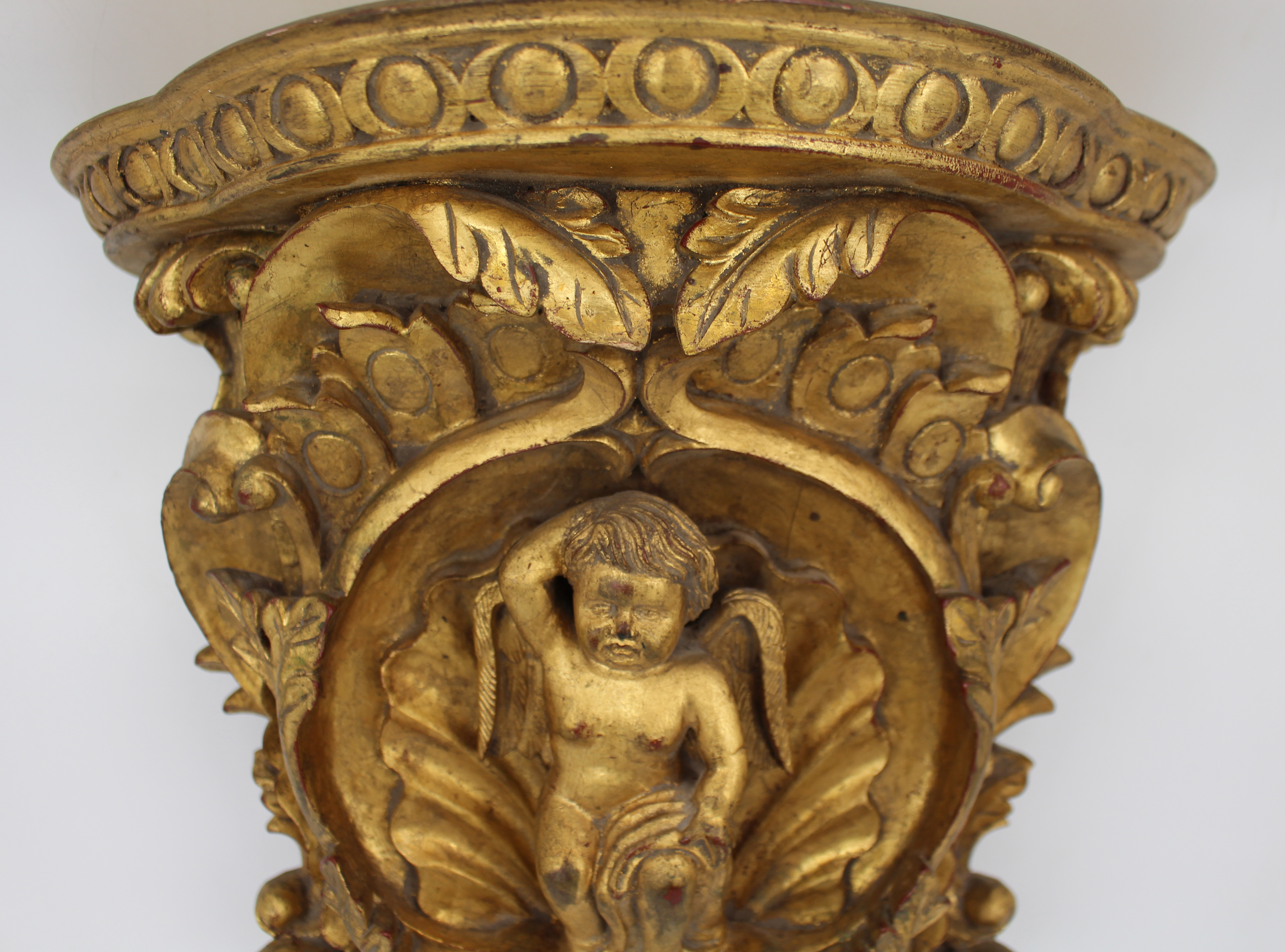 Pair of Carved Giltwood Wall Brackets with Cherub Motifs