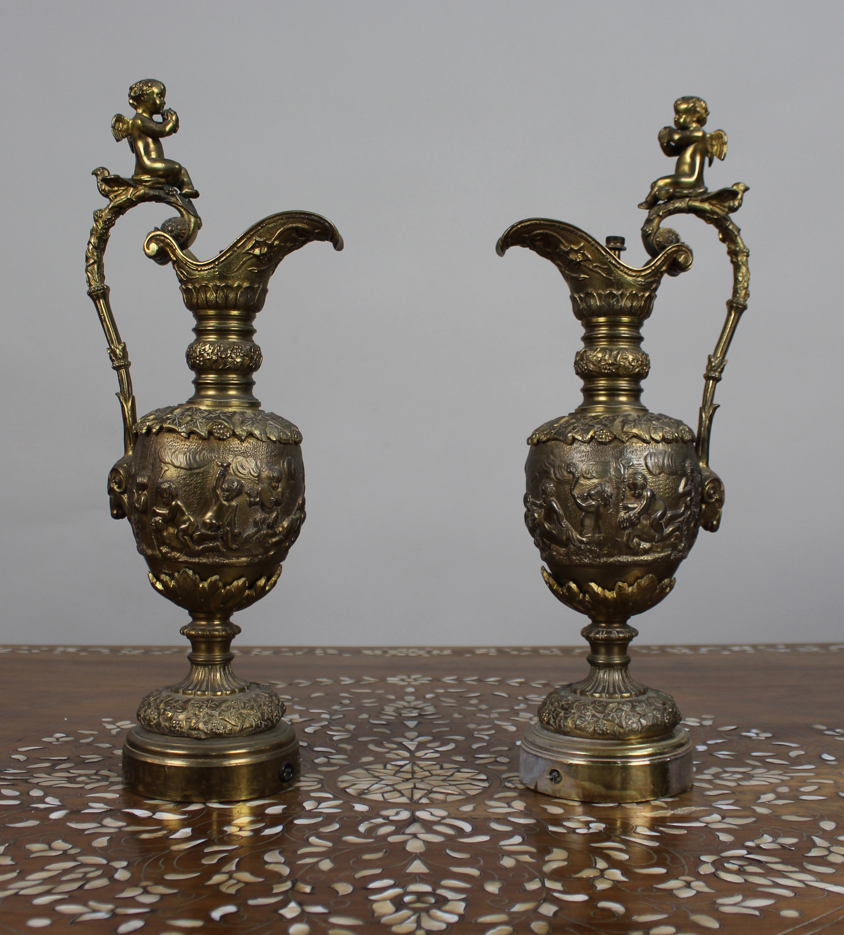 Pair of 19th Century French Gilt Bronze Bacchanalian Ewers with Cherubs