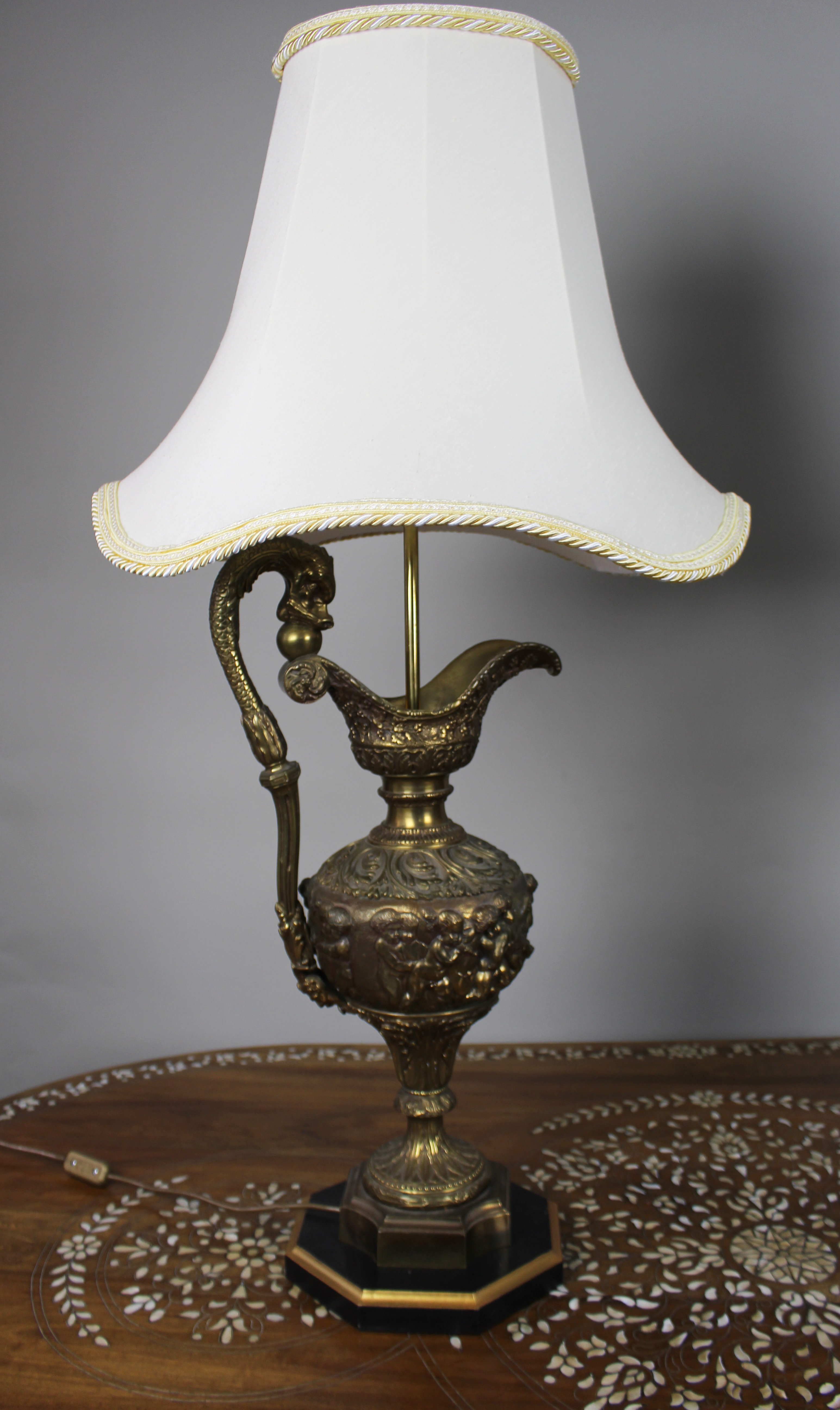Pair of Early 20th Century French Neoclassical Ewer Lamps with Putti Relief