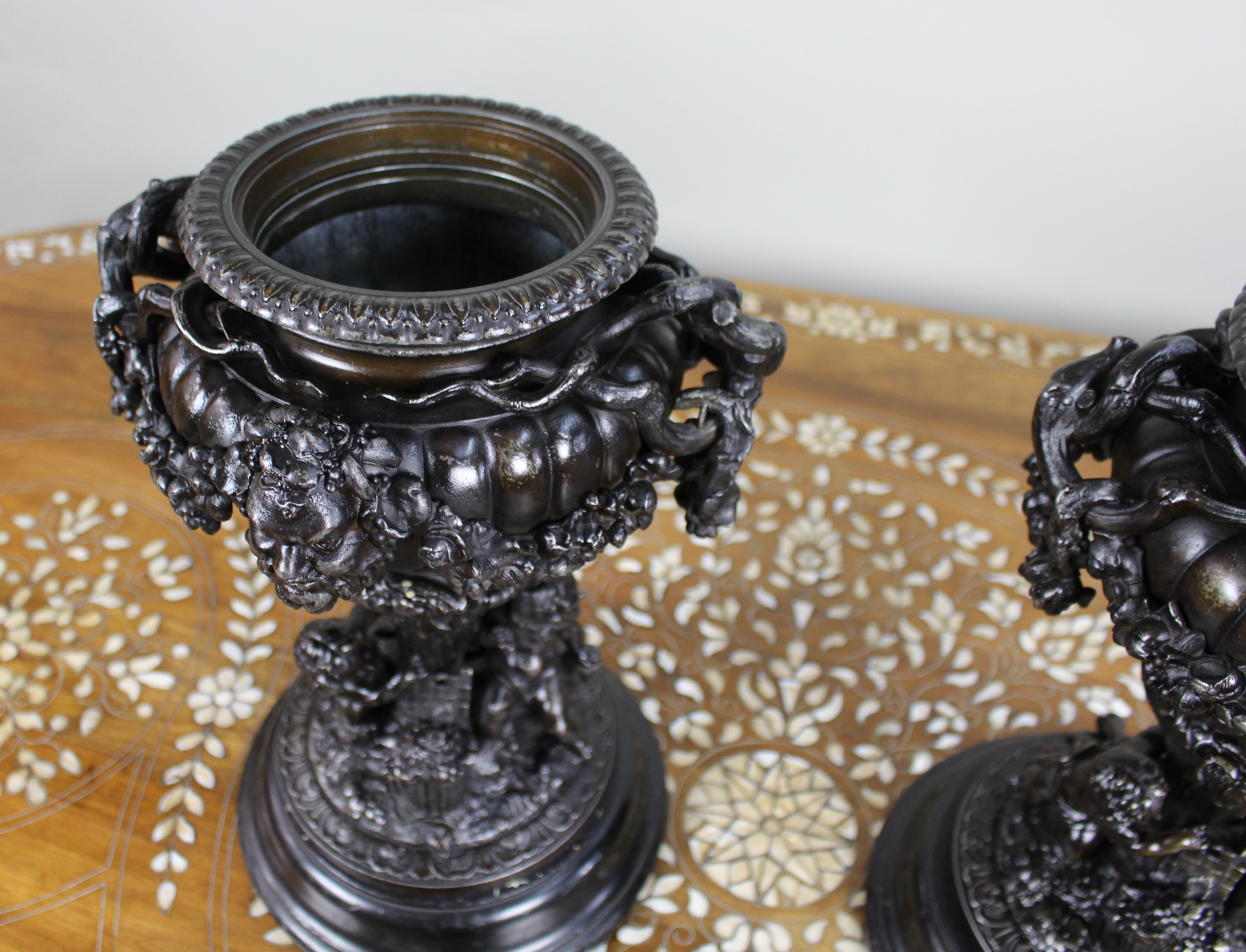 Pair of French Bronzed Spelter Urns with Bacchic Masks and Putti, Circa 1880