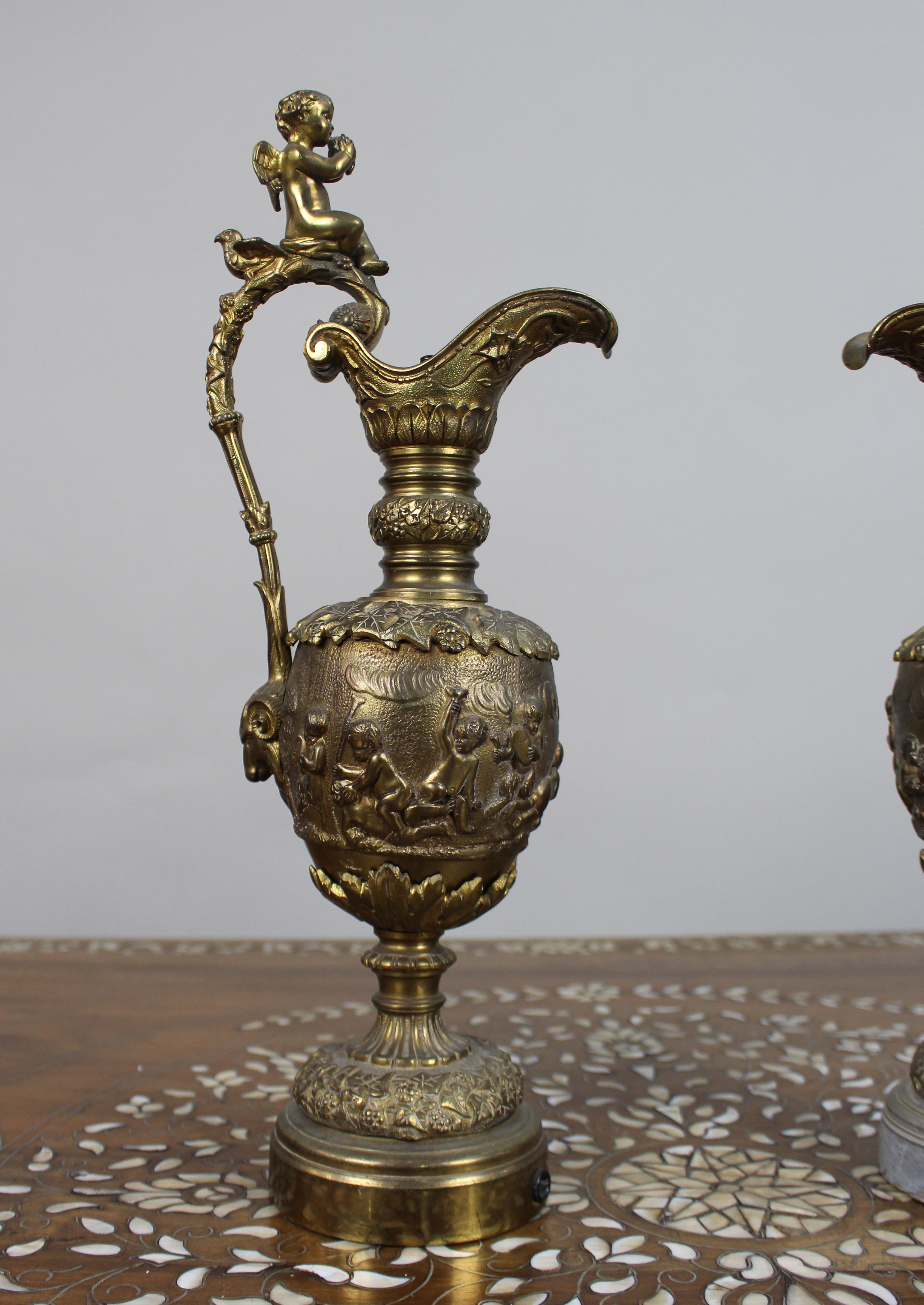 Pair of 19th Century French Gilt Bronze Bacchanalian Ewers with Cherubs