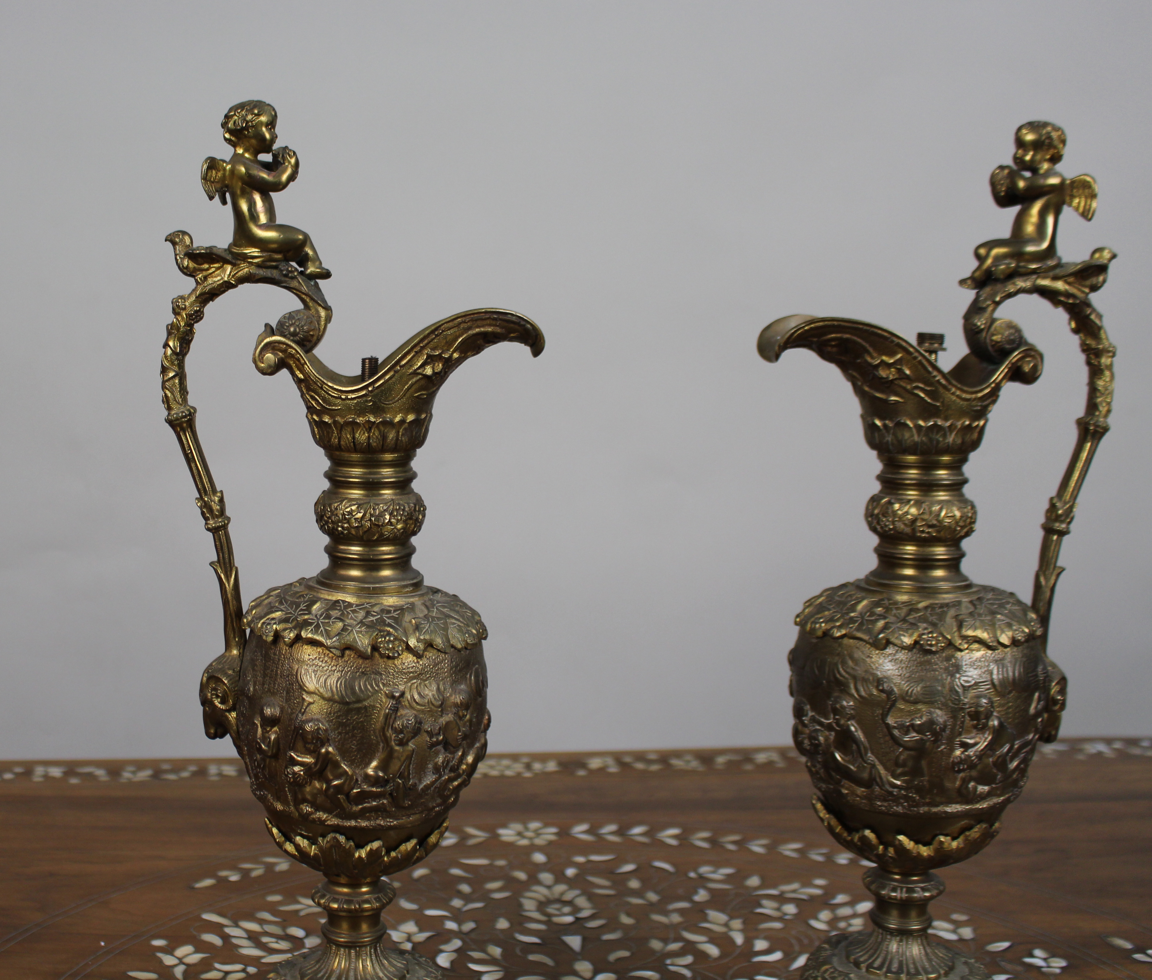 Pair of 19th Century French Gilt Bronze Bacchanalian Ewers with Cherubs