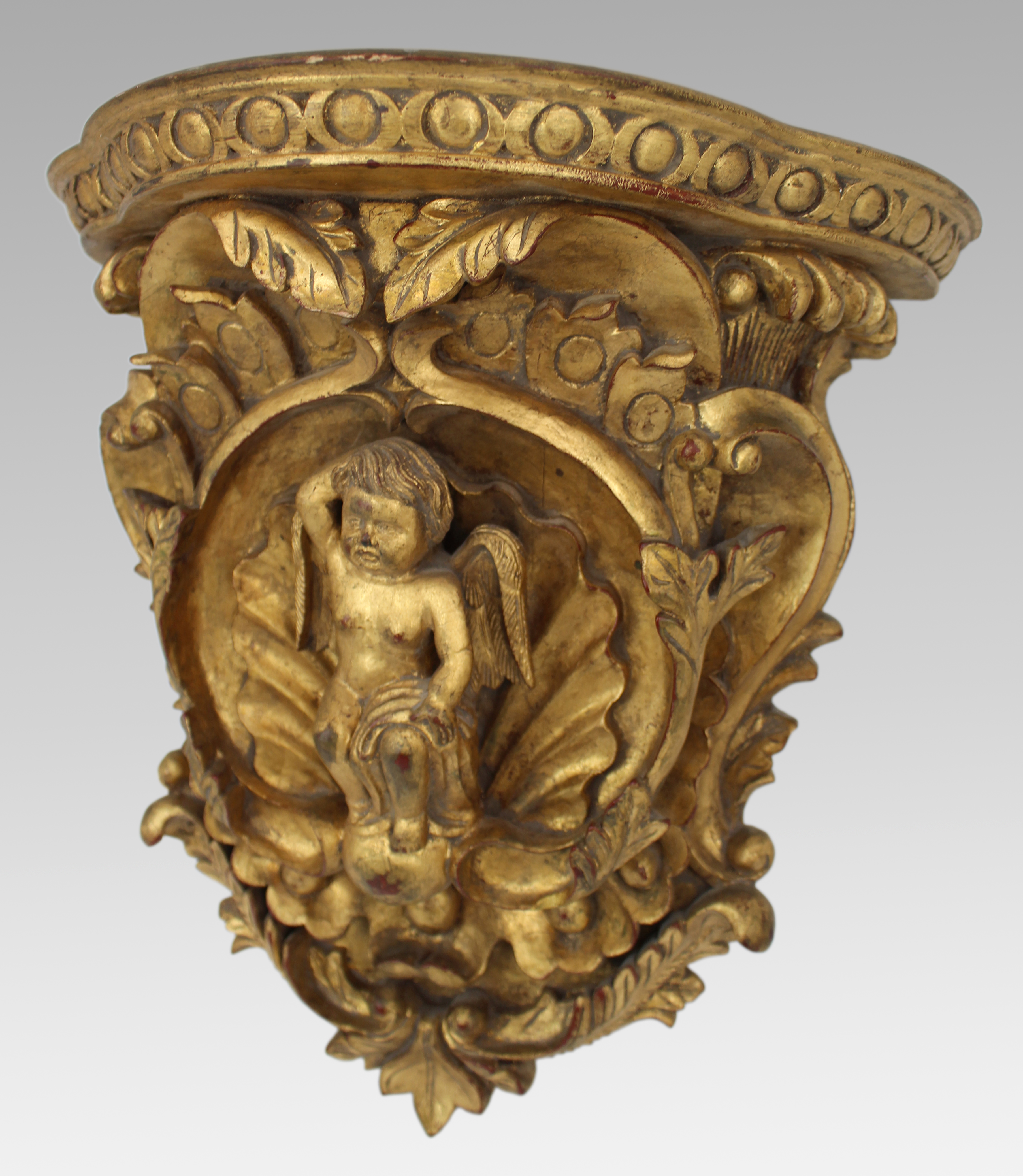Pair of Carved Giltwood Wall Brackets with Cherub Motifs