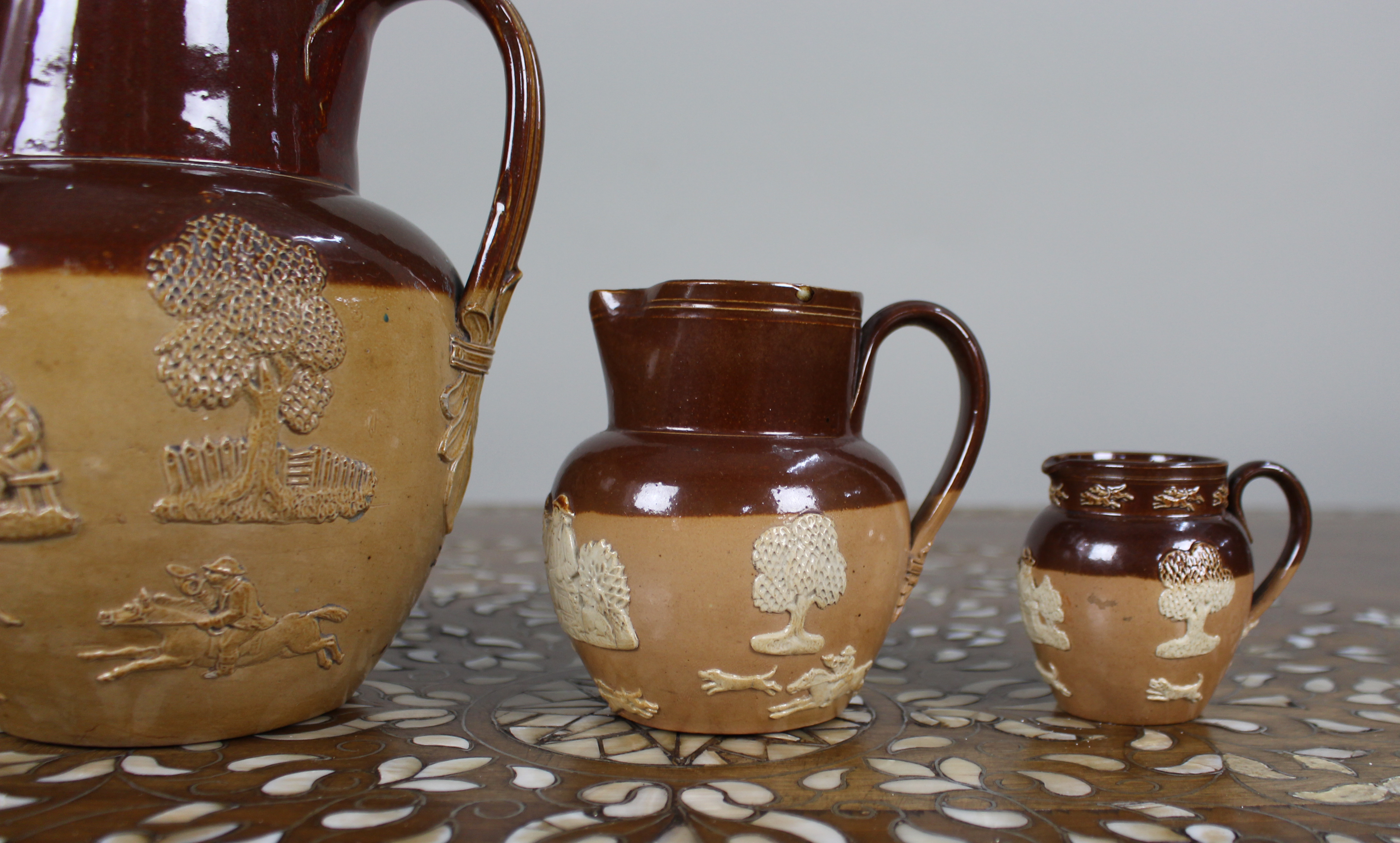 Collection of Three Graduated Doulton Lambeth Stoneware Jugs, c.1900