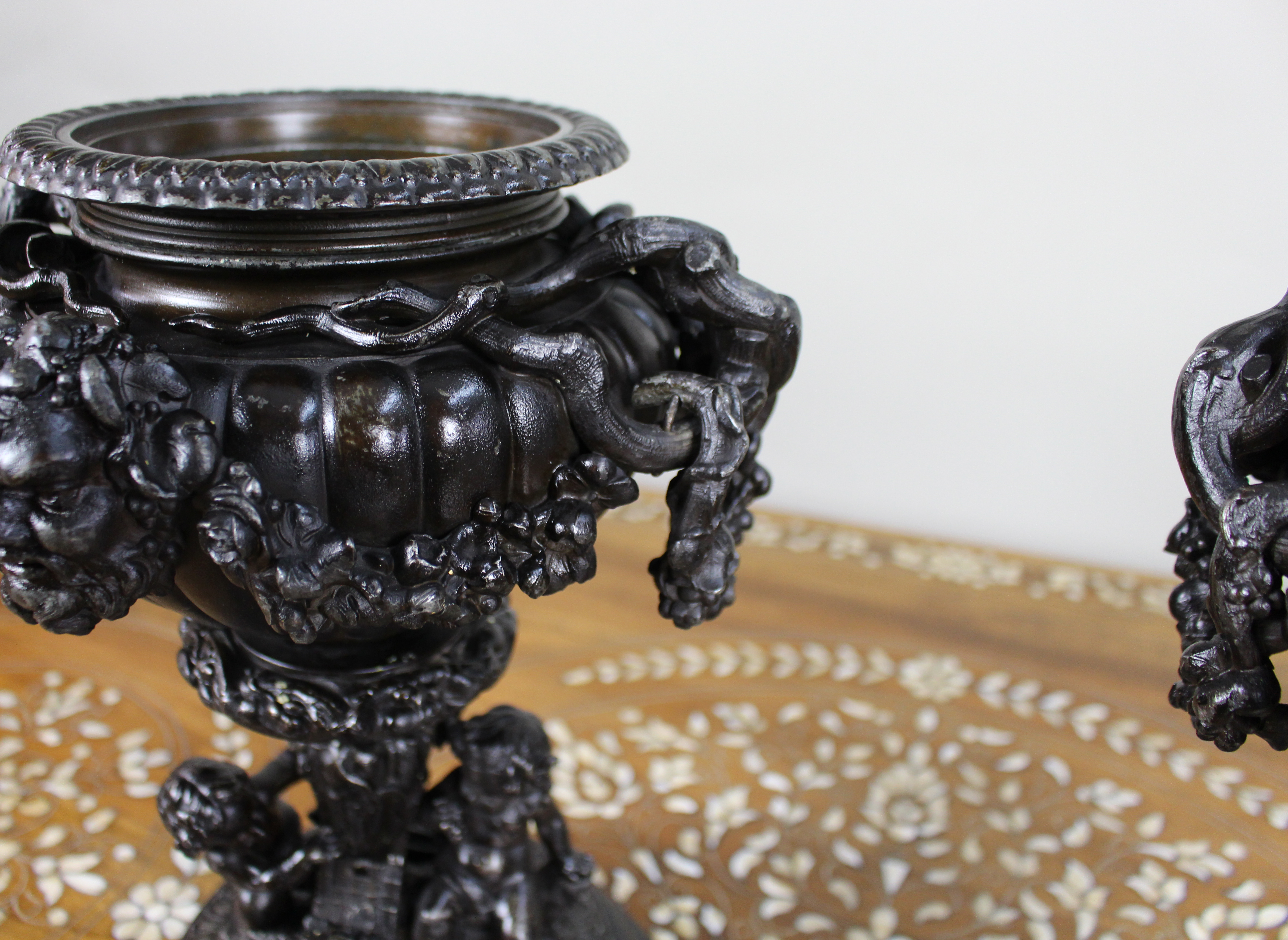 Pair of French Bronzed Spelter Urns with Bacchic Masks and Putti, Circa 1880