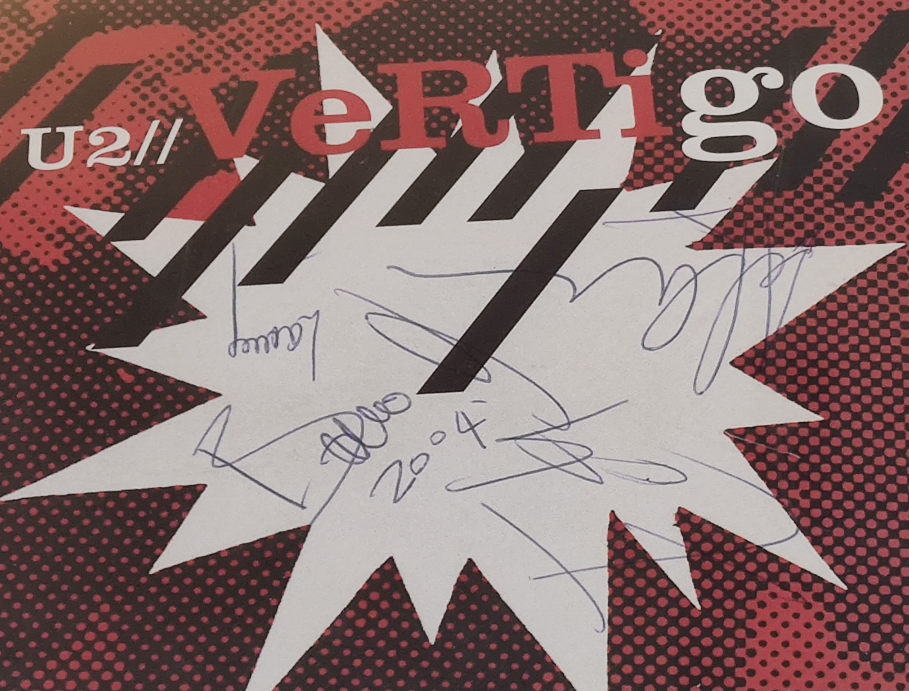 U2 – Vertigo Famed Vinyl Record – Autographed by – Bono, The Edge, Larry Mullen and Adam Clayton.