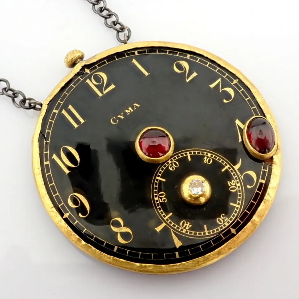 Necklace made of gold and silver, featuring an antique watch dial with precious stones and diamonds