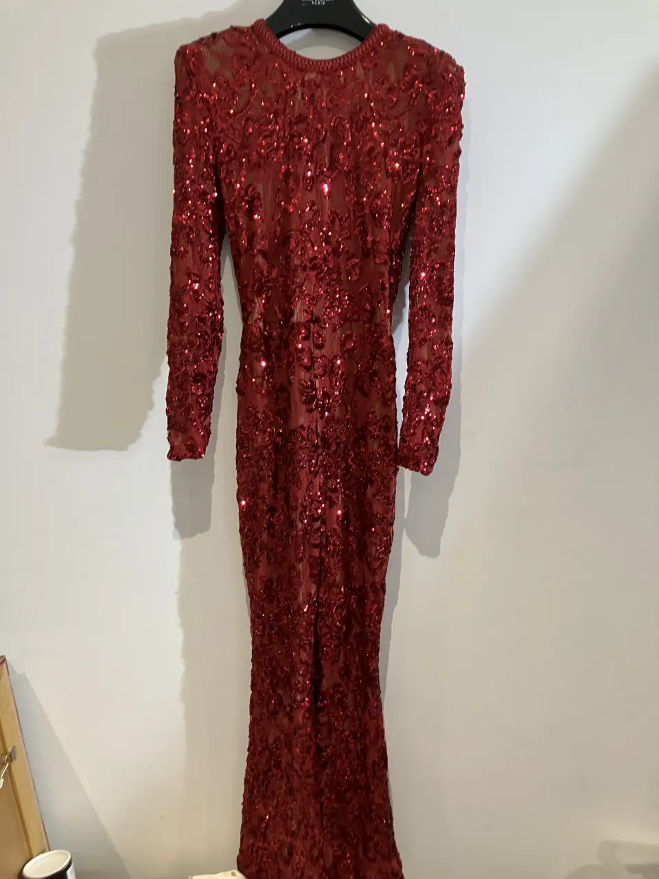 Nadien Merabi red sequin jump suit with belt worn by a body double
