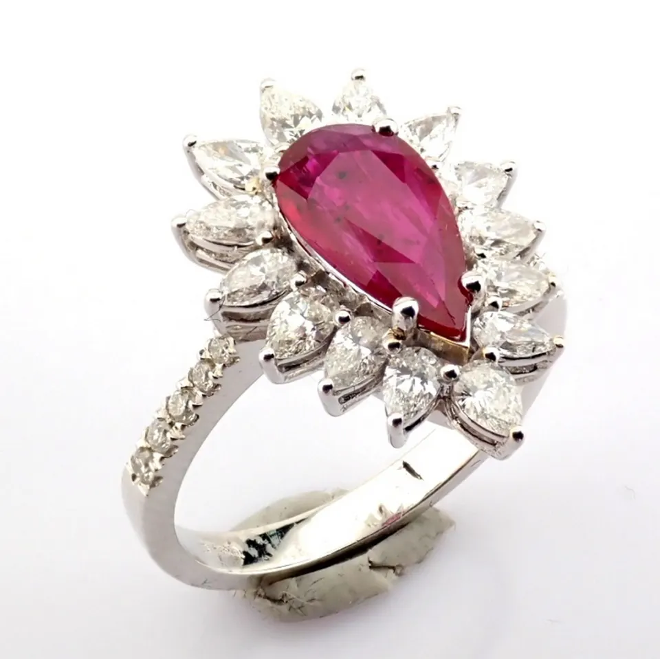 18K white gold cluster ring detailed with ruby and diamonds