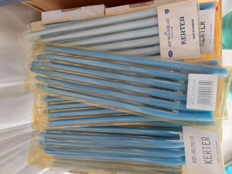 Box of blue taper candles