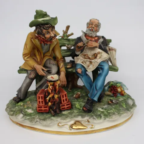 Capodimonte Tramps on Bench by Cortese