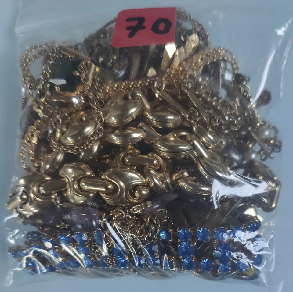 A collection of yellow metal jewellery in a bag. Approximately 298g