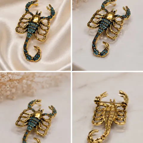 Gold-Tone Scorpion Brooch with Blue Crystal Accents