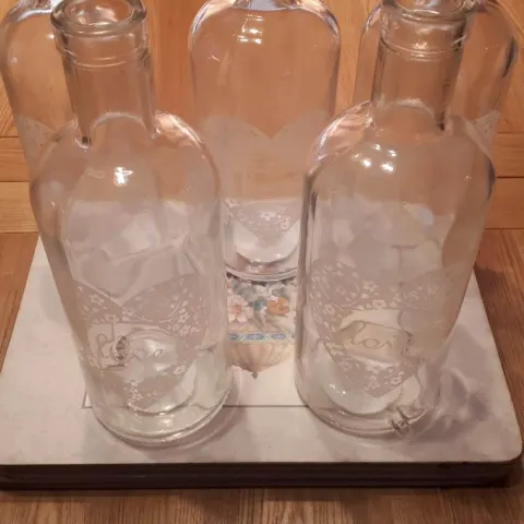 4 boxes of 6 vases with LOVE on them