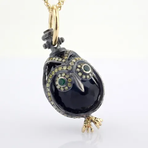 An Exquisite Owl Necklace Detailed With Brilliant Diamonds and Gold On Silver.