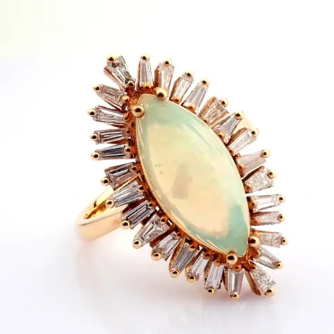 An exquisite  18k rose gold ring detailed with opal and brilliant diamonds.