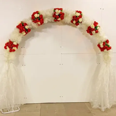 Lot 3; PROFESSIONAL METAL 275cm WEDDING FLOWER ARCH WITH RED & IVORY ARTIFICIAL FLOWERS. RRP £999