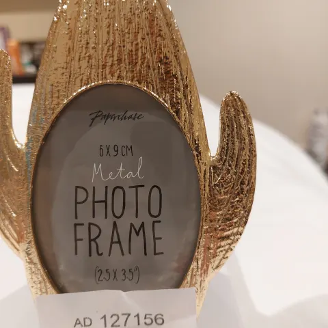 Gold photoframes from Paperchase RRP £12 each.  Set of 4