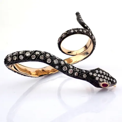 A Snake Ring Detailed With Brilliant Diamonds and Gold On Silver.