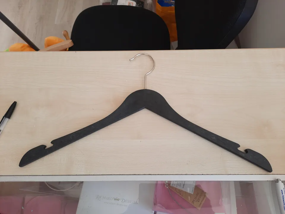 Box of new black coathangers