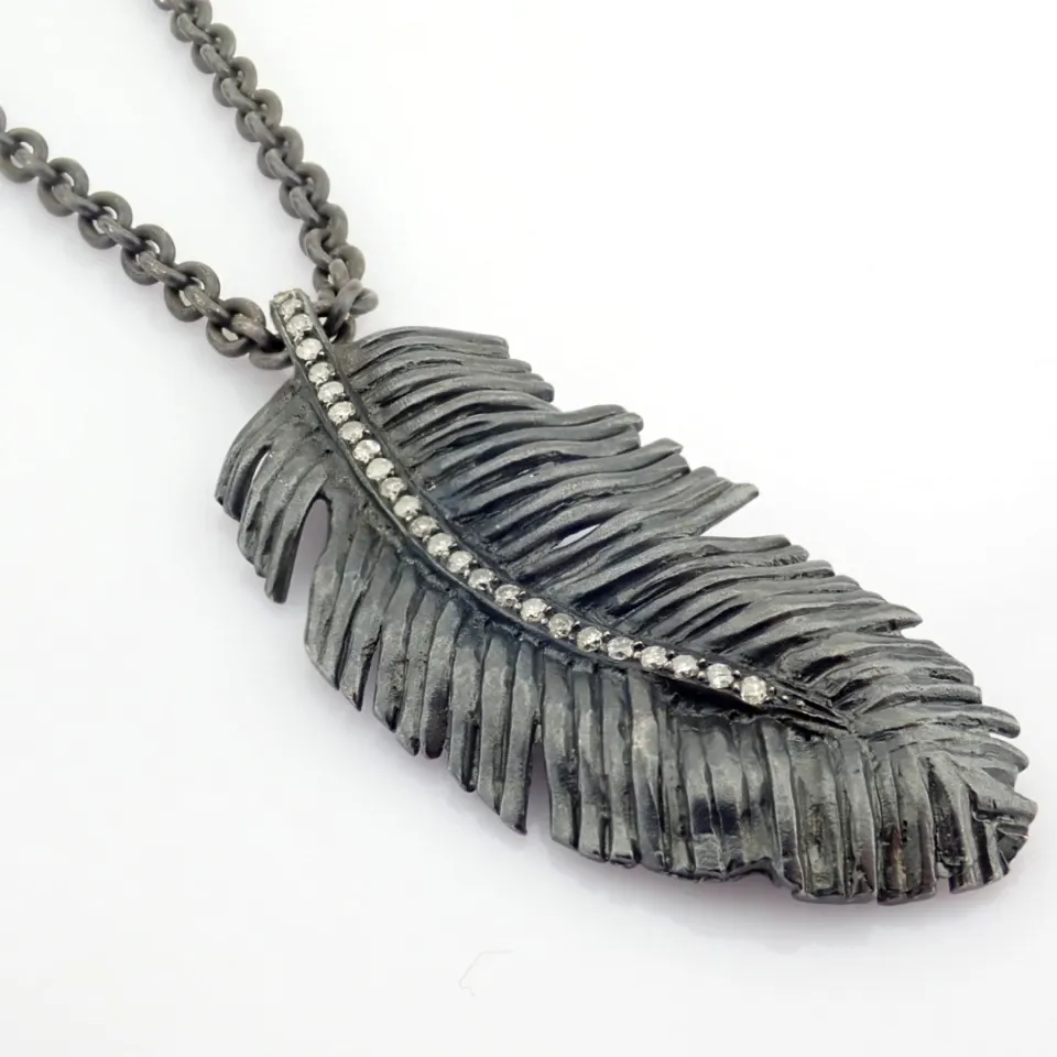 An Exquisite Feather Necklace Detailed With Brilliant Diamonds and Gold On Silver.