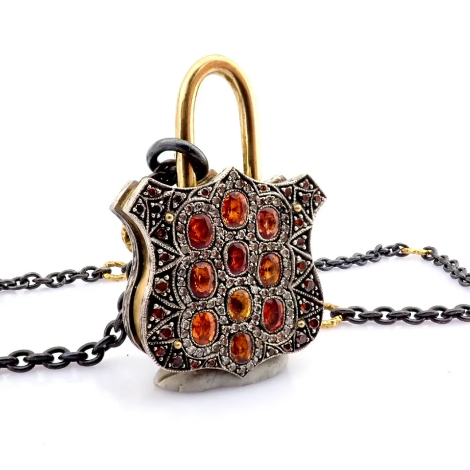 Convertible clasp necklace embellished with gold, colorful stones and diamonds on silver
