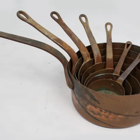 Set of 7 Graduated Copper Saucepans