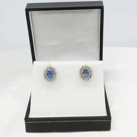 Vintage pair of cornflower blue sapphire and diamond ear studs with screw back clip on fittings