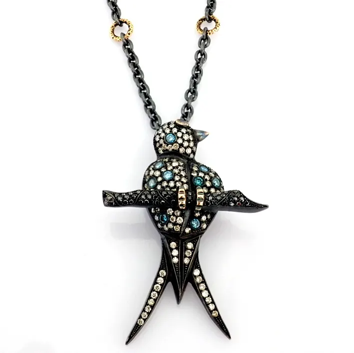 An Exquisite Bird Necklace Detailed With Brilliant Diamonds and Gold On Silver.