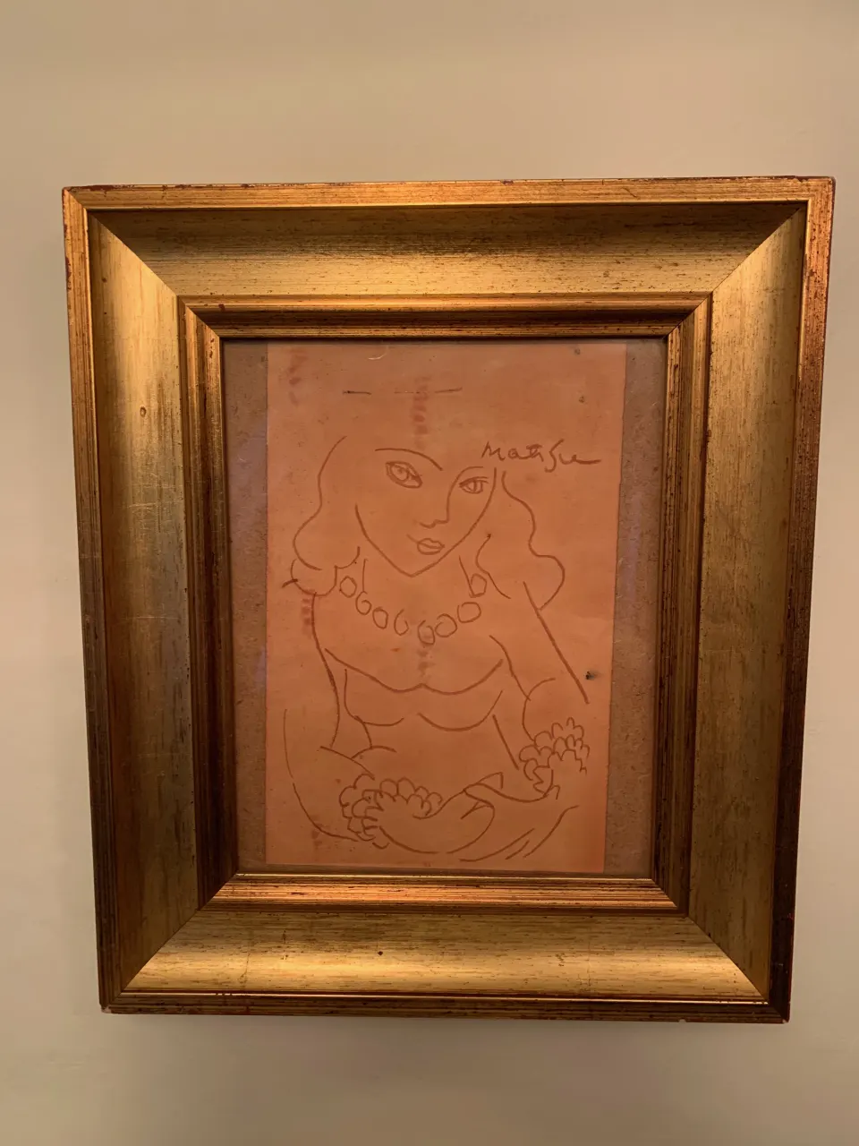 An After Henri Matisse, Signed, Crayon Drawing of A Female Figure In Red Crayon On A Coloured Paper