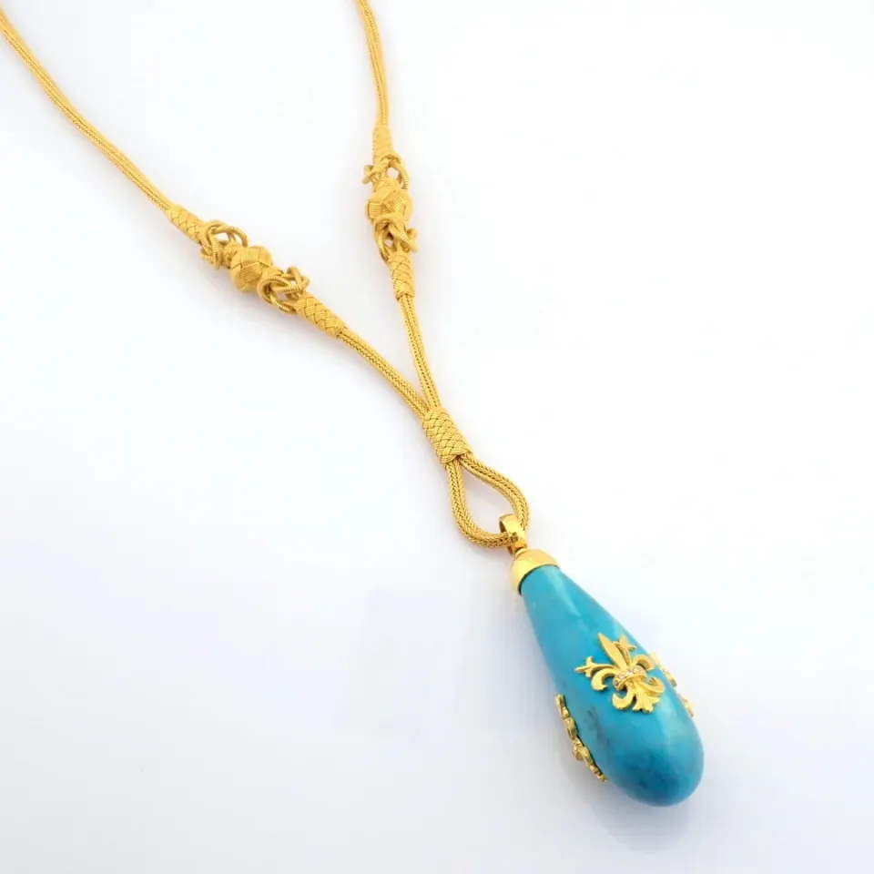 A Handwoven 24Kt Gold Necklace Adorned With Precious Stones.