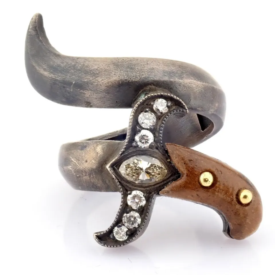 An exquisite sword ring detailed with ebony, brilliant diamonds and gold on silver.