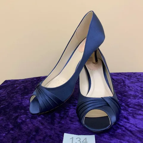 Designer shoes navy in size 4.5.  Code 134