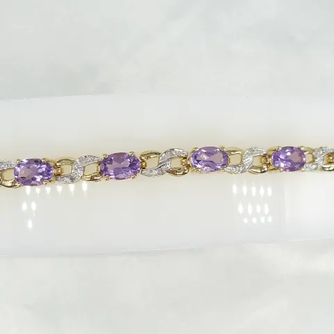 Yellow gold articulated bracelet set with amethysts and diamonds, boxed