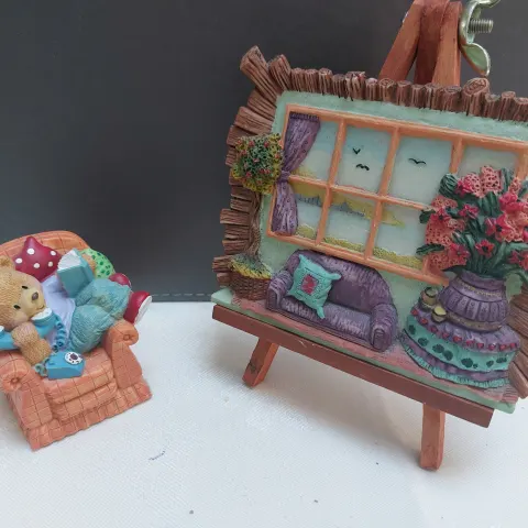Easel, painting and armchair bear