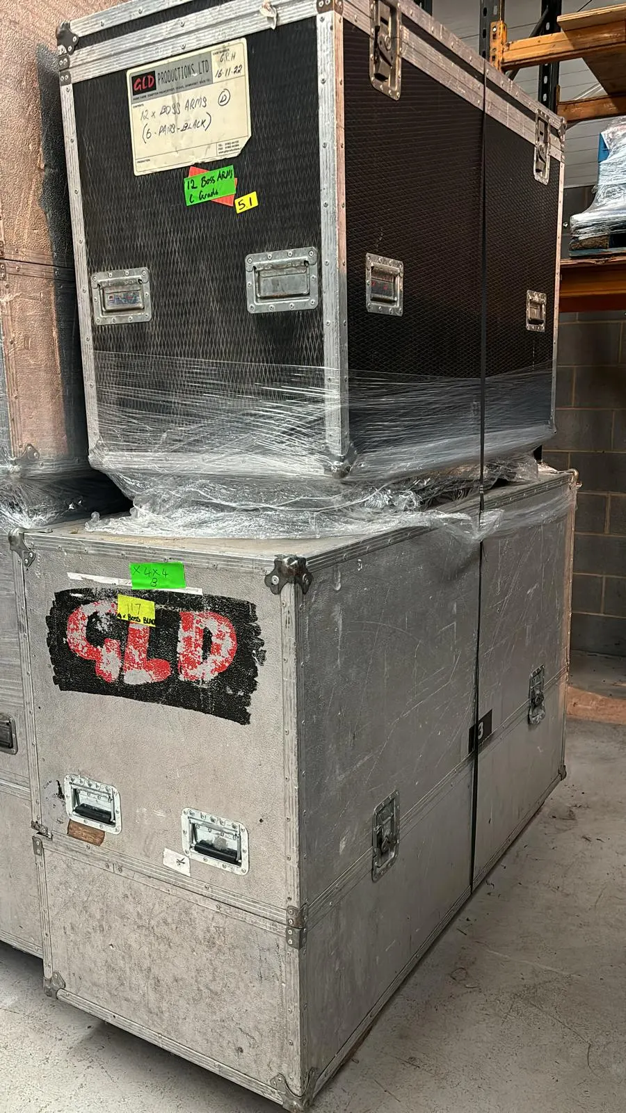 2x Flight Cases with 4 Seater Black Modular Sofa and arms