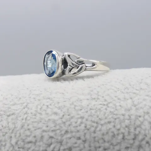 Silver Ring Set With An Oval Light Blue Cubic Zirconia and Celtic Patterned Shoulders
