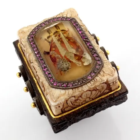Bone and ebony-carved ring with topaz, featuring a reverse-engraved sword, diamonds, gold in silver