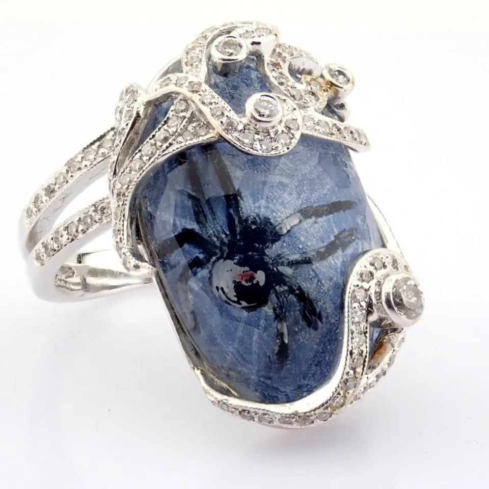 An Exquisite Handmade Gold Ring Intricately Detailed With Topaz, Featuring A Reverse-Engraved Intagl