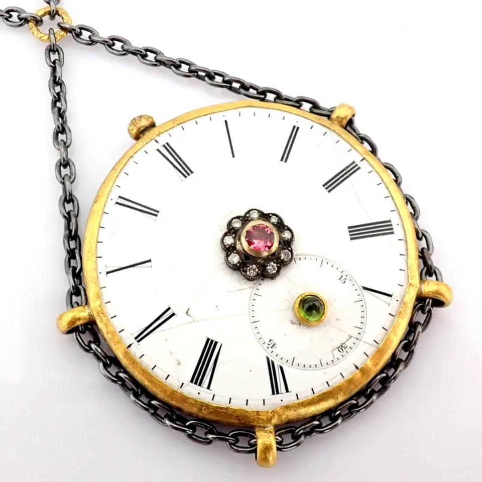Necklace made of gold and silver with antique watch dial with precious colorful stones and diamonds