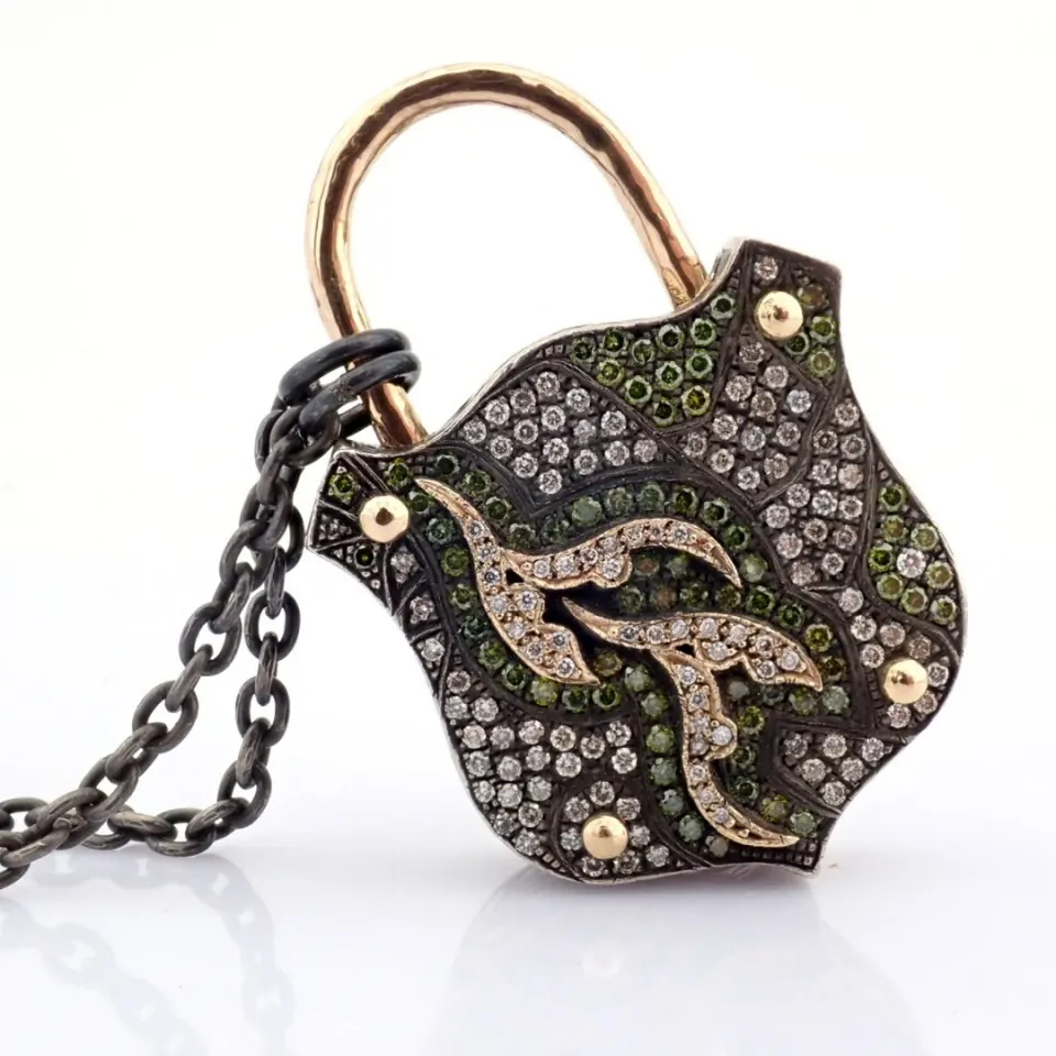 An Exquisite, Convertible Clasp Necklace Embellished With Gold and Diamonds On Silver