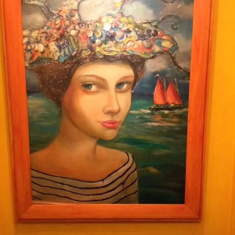 A “very large “ canvas print of a lady with yachts showing on the right